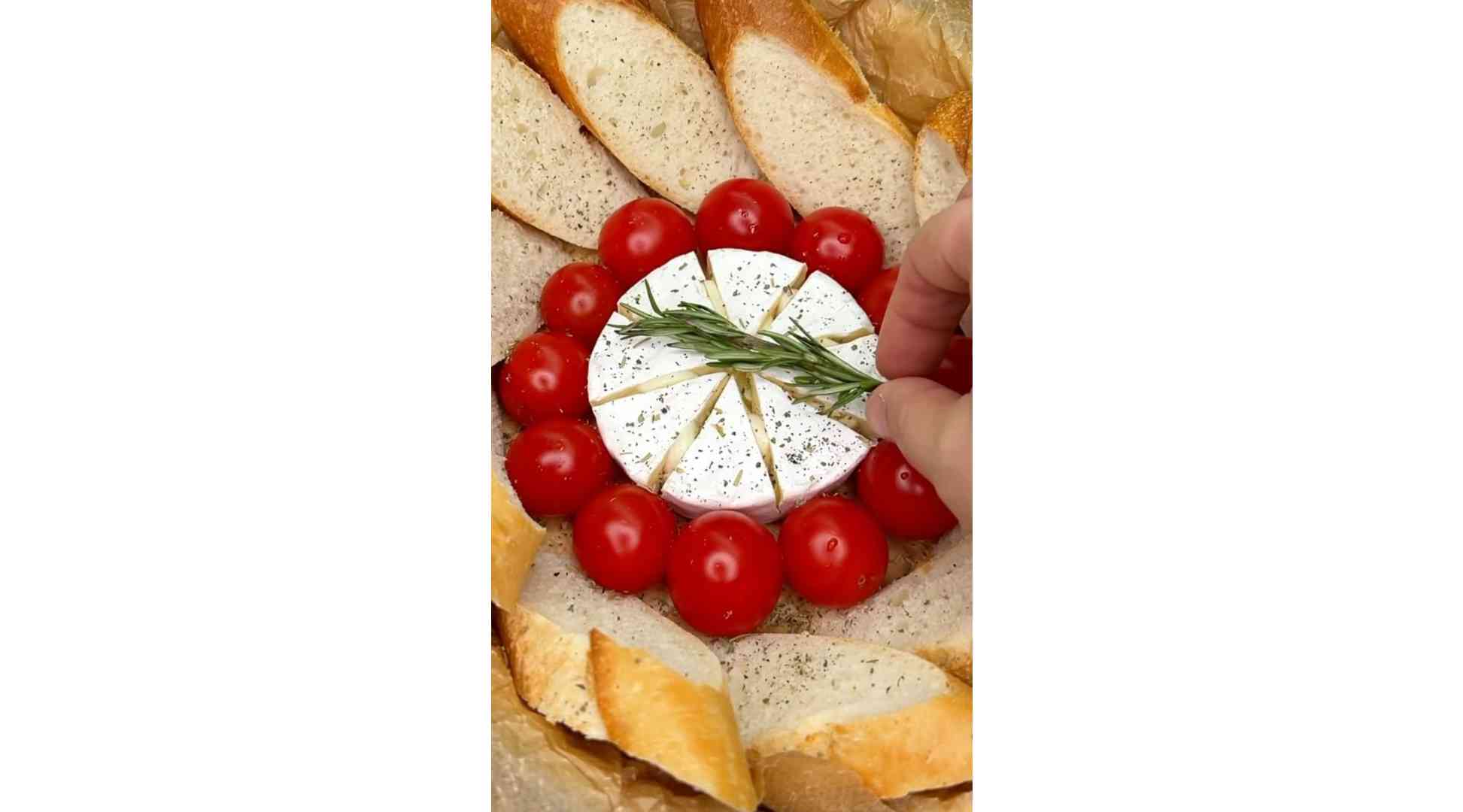 Camembert cheese in the oven with baguette.
